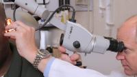 Dr. Lustig looking into a patient's ear